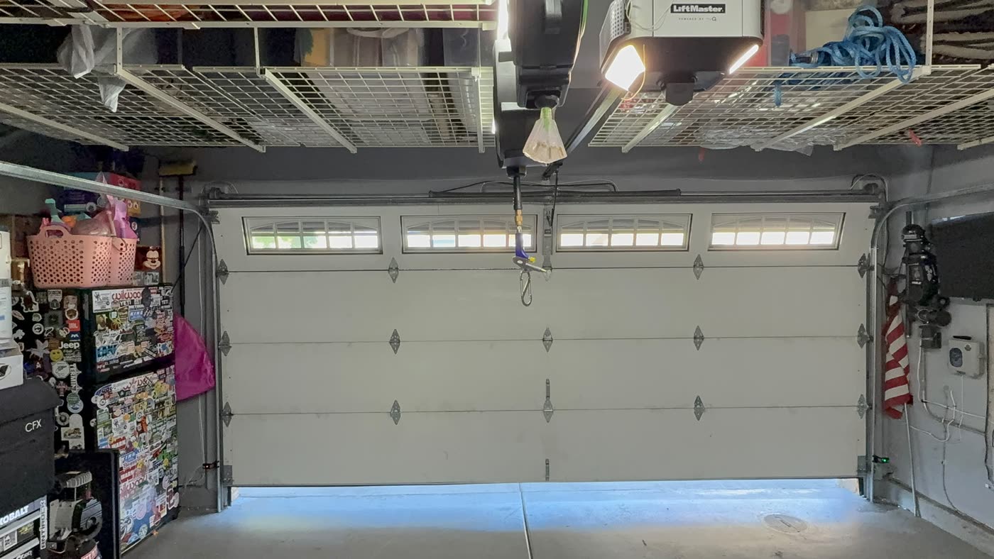 Brand-new insulated garage door installed, closed and running on a LiftMaster opener