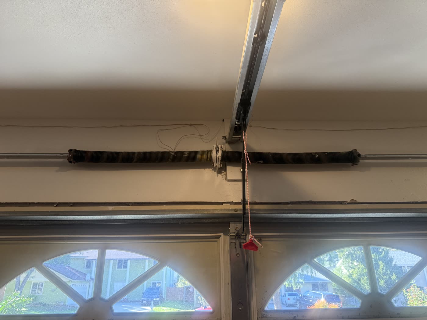 Fifteen-year-old worn garage door torsion springs before replacement